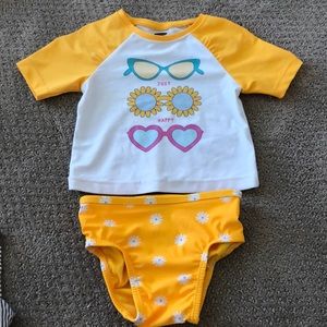 Toddler Bathing Suit 6-12 MO, bottoms never worn. We only wore the top.